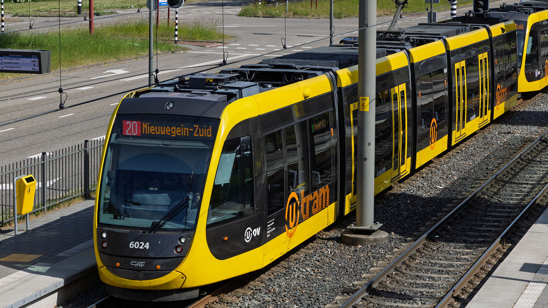 A modern yellow and black tram for Nieuwegein Zuid on its tracks